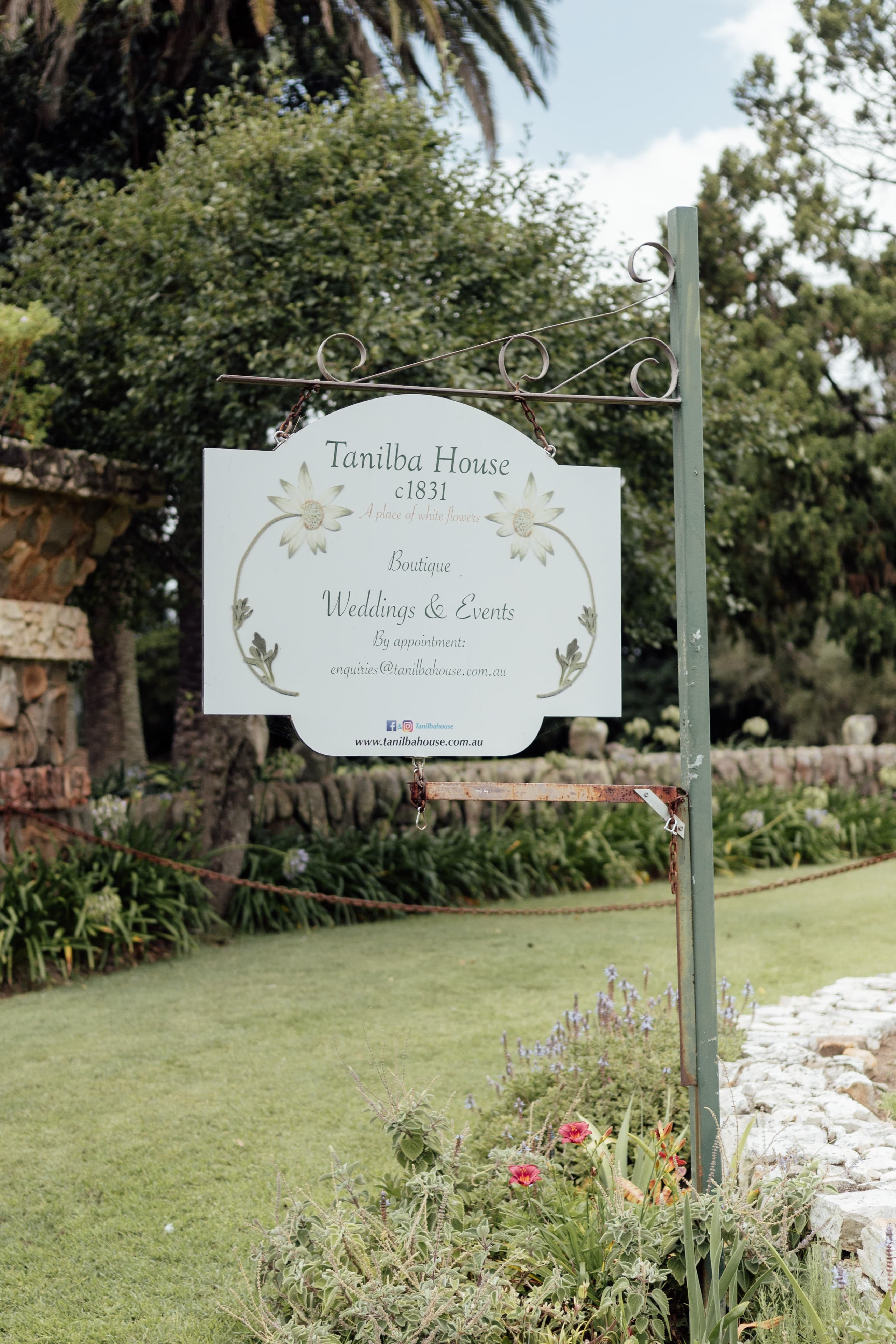 Venue sign in the front garden : Tanilba House Boutique Weddings and Events