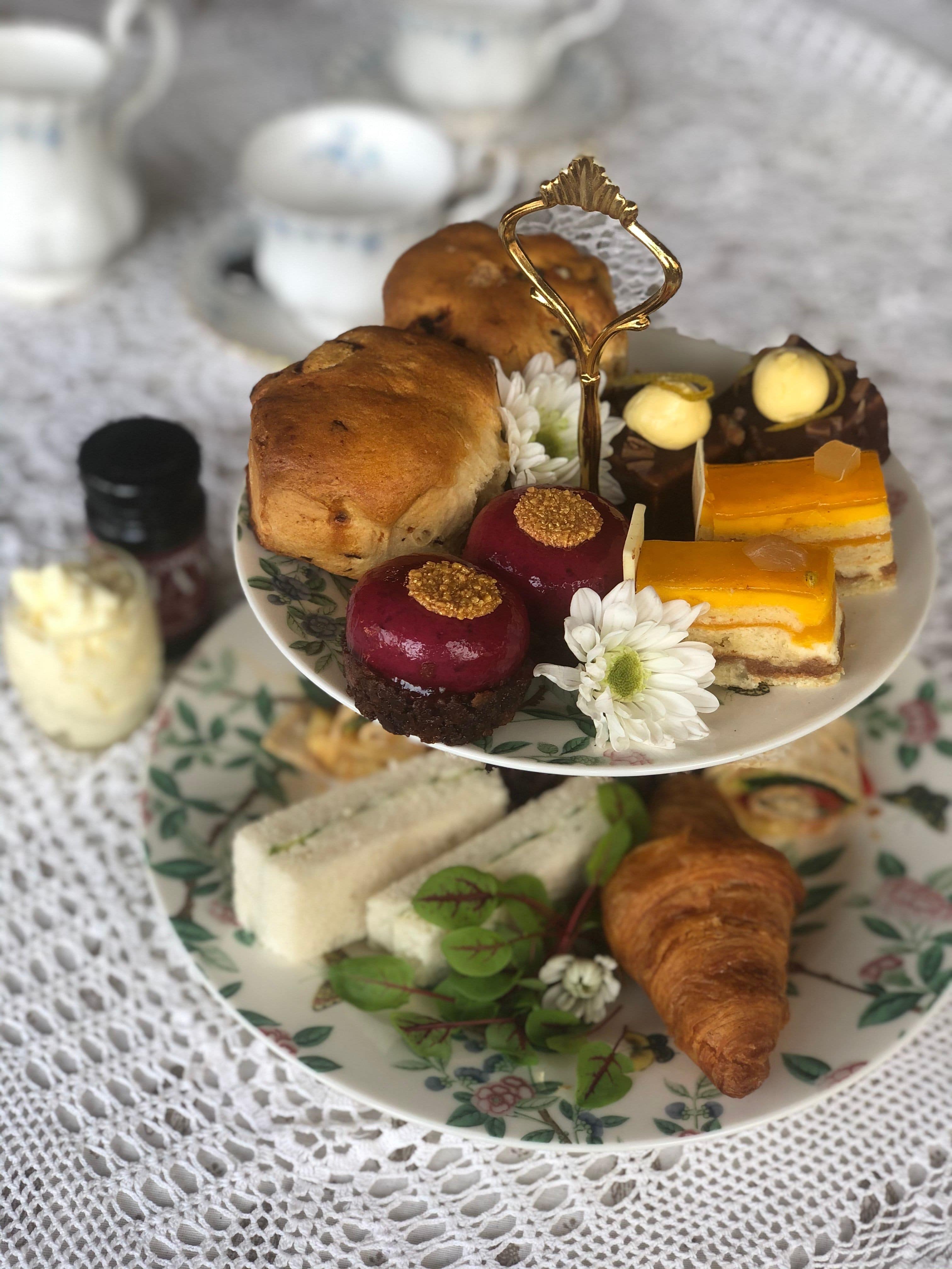 High tiered plate of high tea items