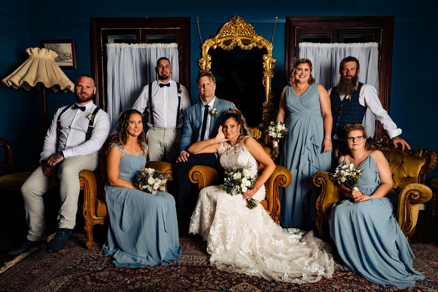 Bridal party with mirror and gold lounges  in heritage colonial parlour posed in vintage style, Tanilba House, Port Stephens
